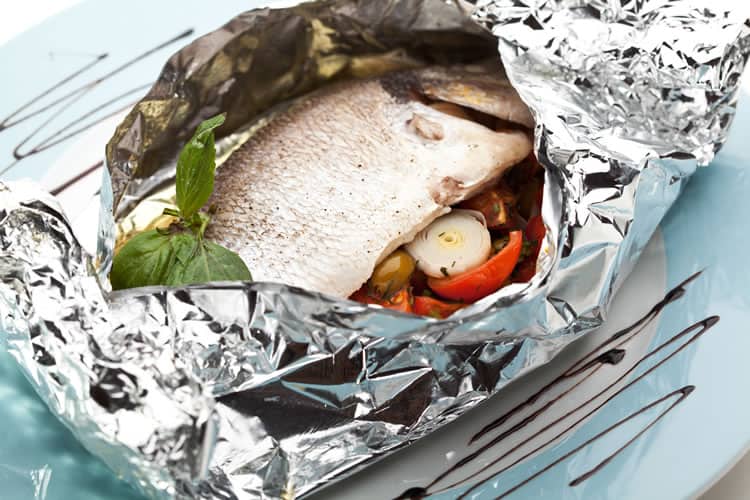 Fish in foil with cherry tomatoes